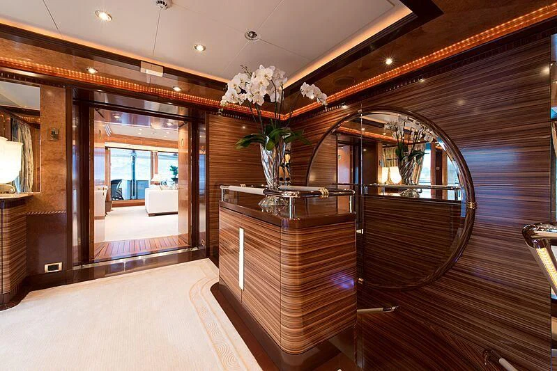 a room with a glass door and a wood floor aboard LUDZIE Yacht for Sale
