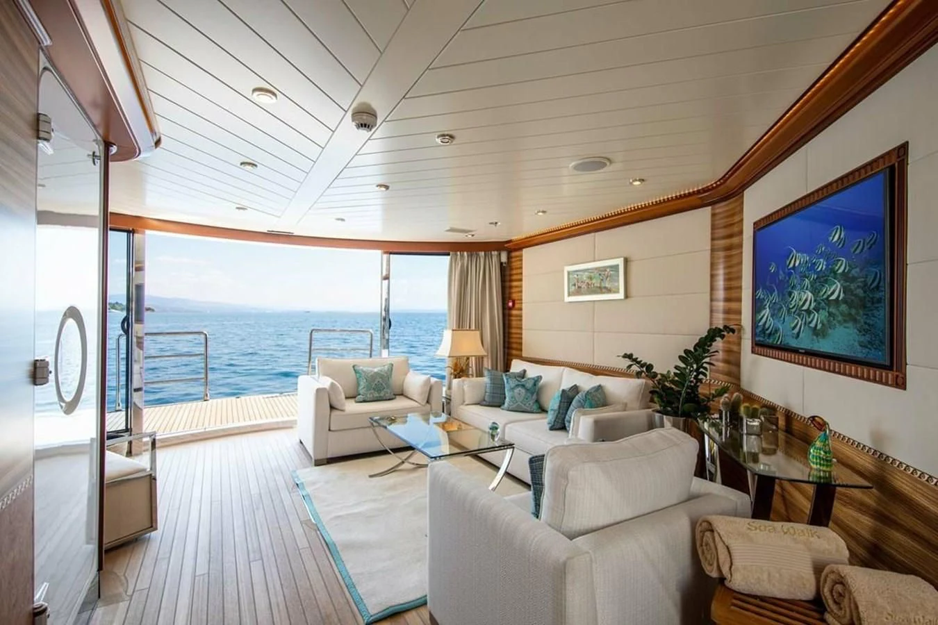 a living room with a large ocean aboard LUDZIE Yacht for Sale