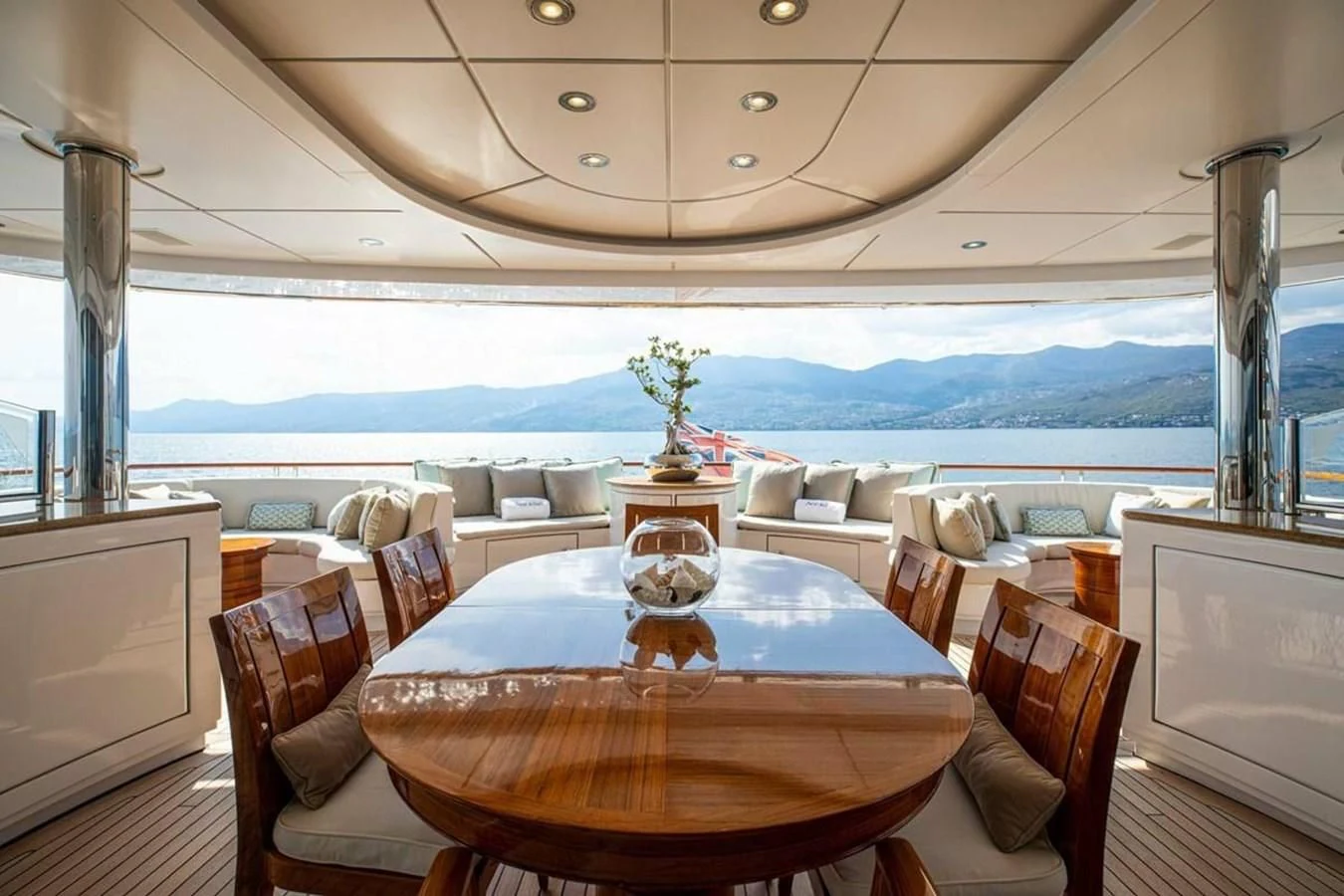 a room with a table and chairs aboard LUDZIE Yacht for Sale