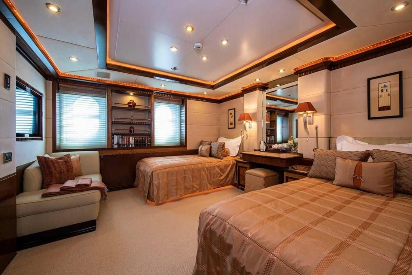 a large bedroom with a bed and a couch aboard LUDZIE Yacht for Sale