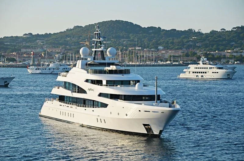 a couple of white yachts in the water aboard LUDZIE Yacht for Sale