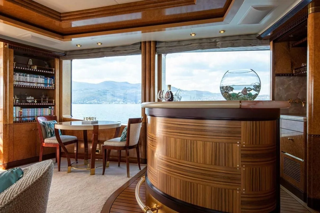 a room with a table chairs and a window aboard LUDZIE Yacht for Sale