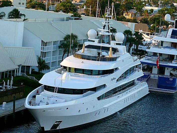 a large white yacht docked aboard LUDZIE Yacht for Sale