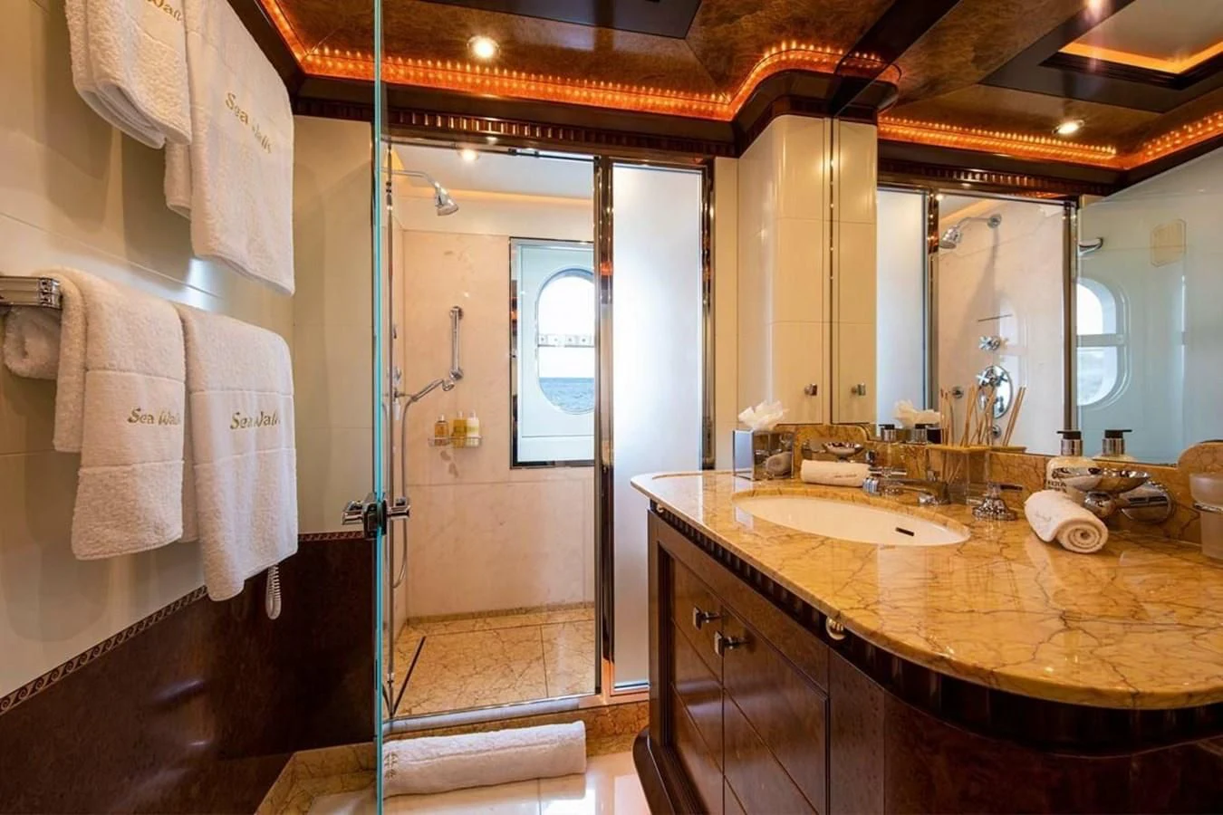 a bathroom with a countertop sink and a mirror aboard LUDZIE Yacht for Sale