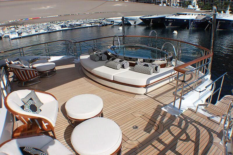 a deck with a large ship in the water aboard LUDZIE Yacht for Sale