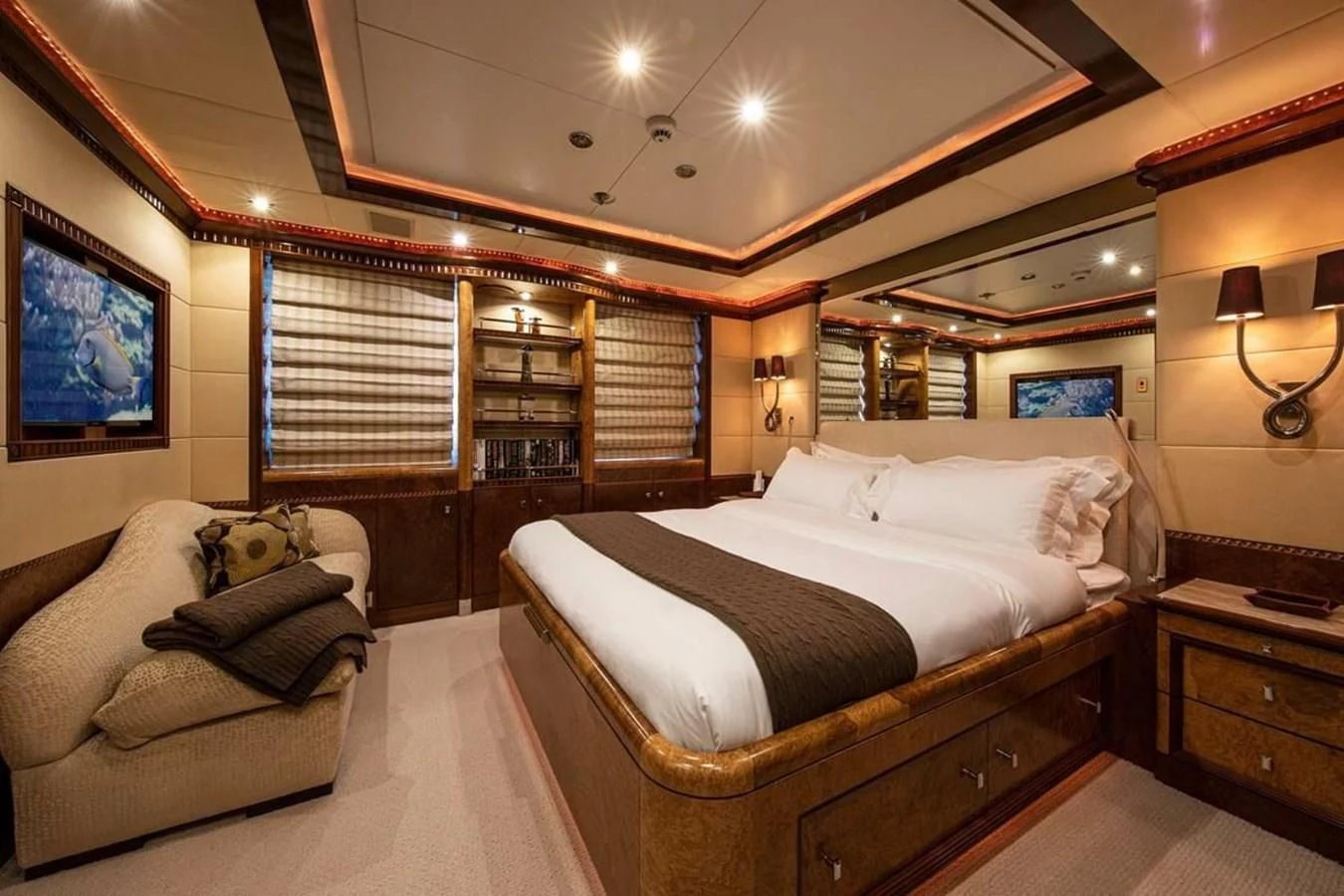 a large bedroom with a bed and a couch aboard LUDZIE Yacht for Sale