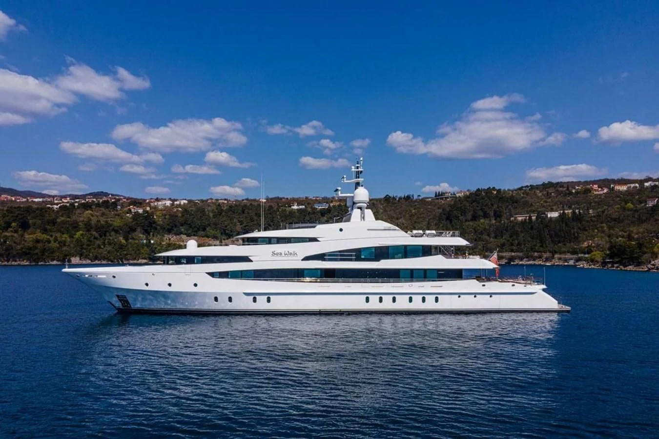 a white yacht on the water aboard LUDZIE Yacht for Sale