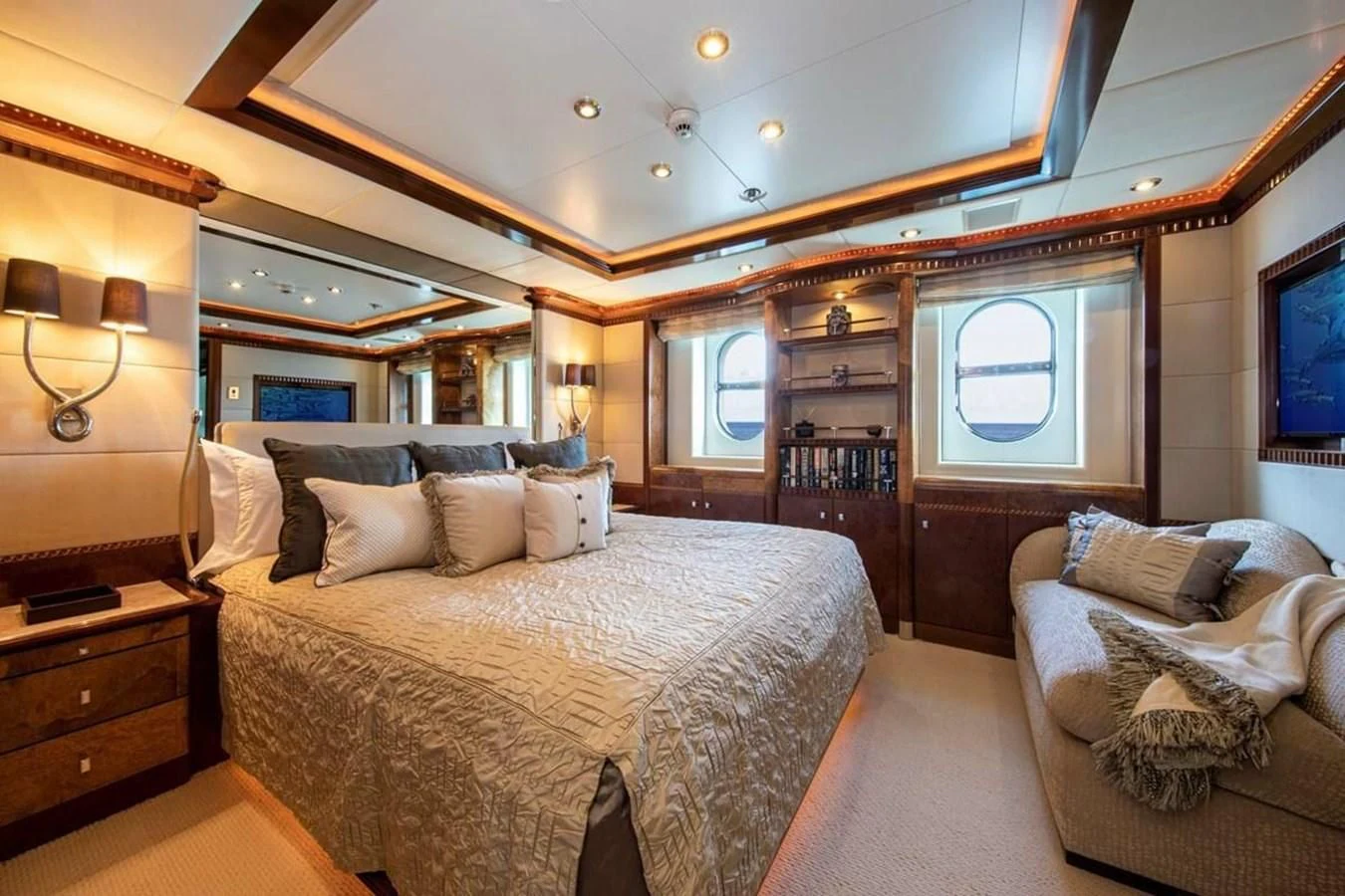 a bedroom with a bed and a couch aboard LUDZIE Yacht for Sale
