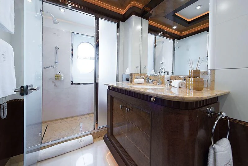 a bathroom with a countertop sink and a mirror aboard LUDZIE Yacht for Sale