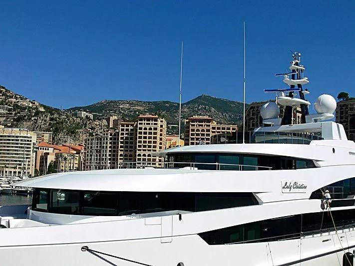 a white yacht in a harbor aboard LUDZIE Yacht for Sale