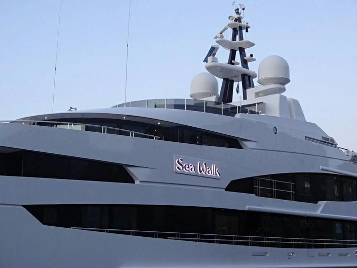 a large yacht with a large antenna on top aboard LUDZIE Yacht for Sale