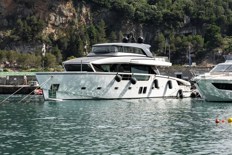 a couple of boats in a body of water aboard LUAR Yacht for Charter