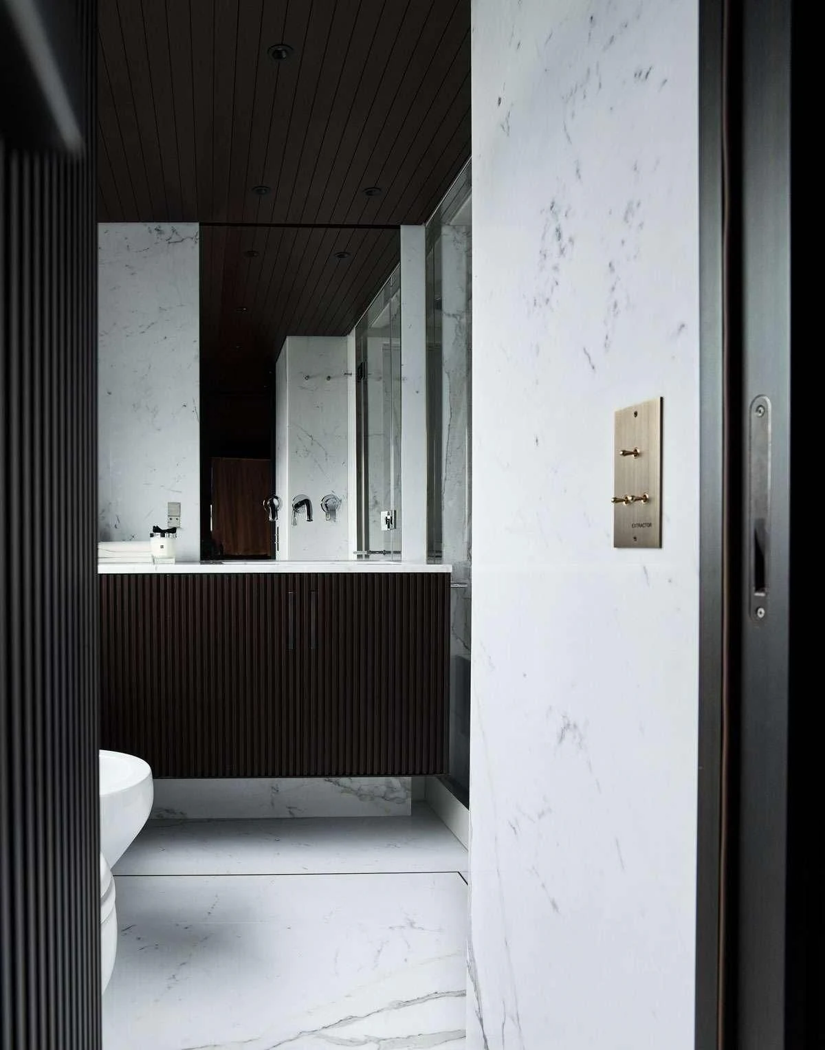 a bathroom with a toilet and a sink aboard LUAR Yacht for Charter