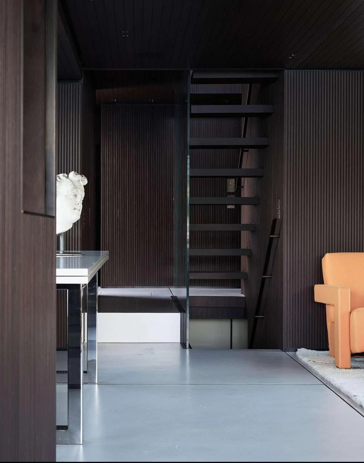 a cat sitting on a shelf aboard LUAR Yacht for Charter