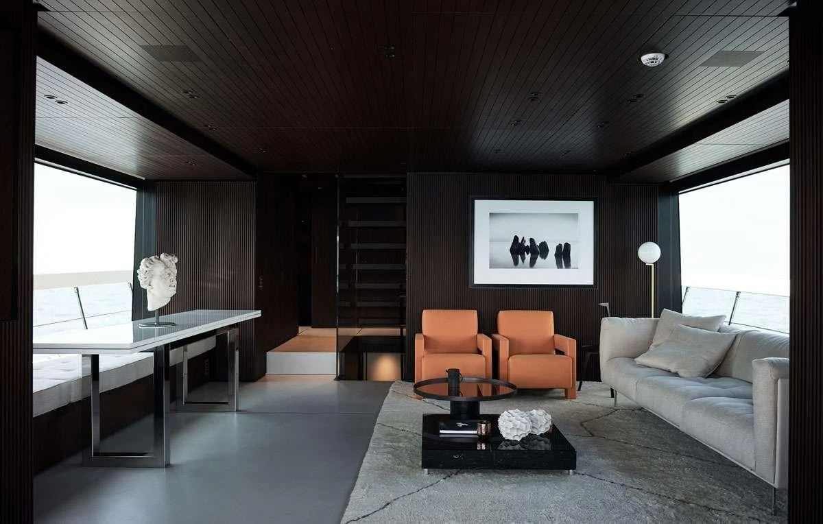 a living room with a large window aboard LUAR Yacht for Charter