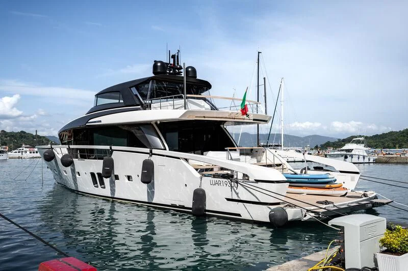 a boat docked at a pier aboard LUAR Yacht for Charter
