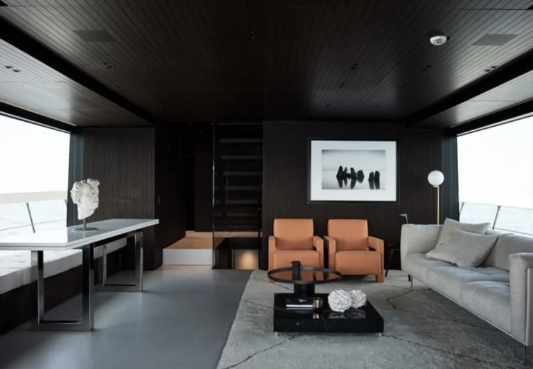 a living room with a large window aboard LUAR Yacht for Charter