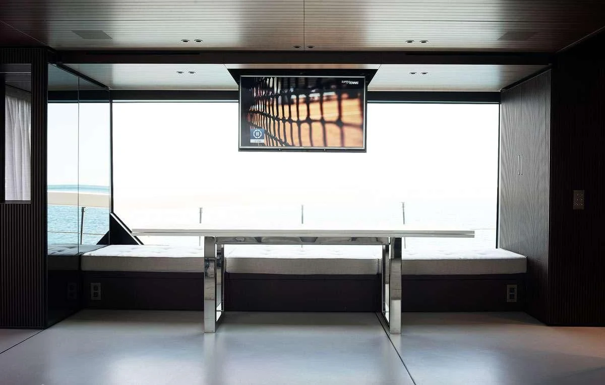 a room with a large window aboard LUAR Yacht for Charter