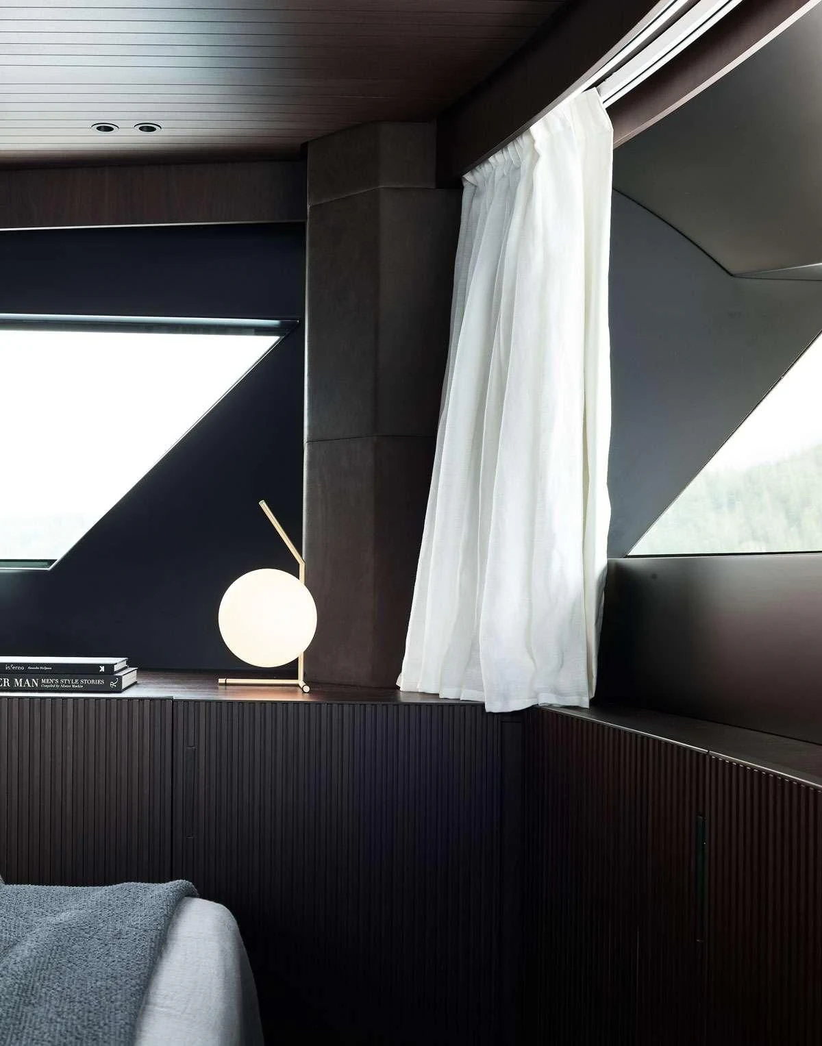 a lamp on a table aboard LUAR Yacht for Charter