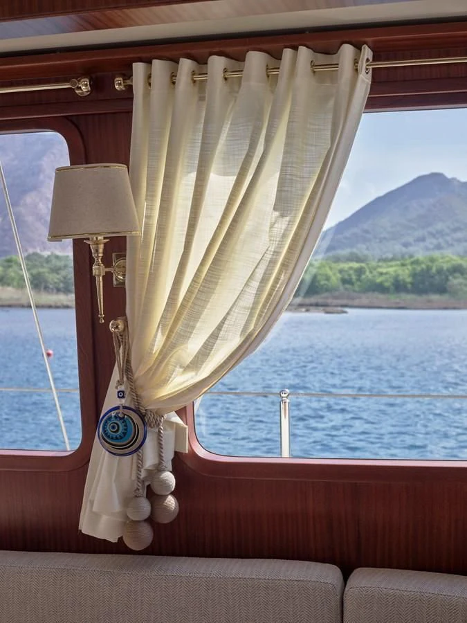 a boat with a lamp shade aboard KAFTAN Yacht for Sale