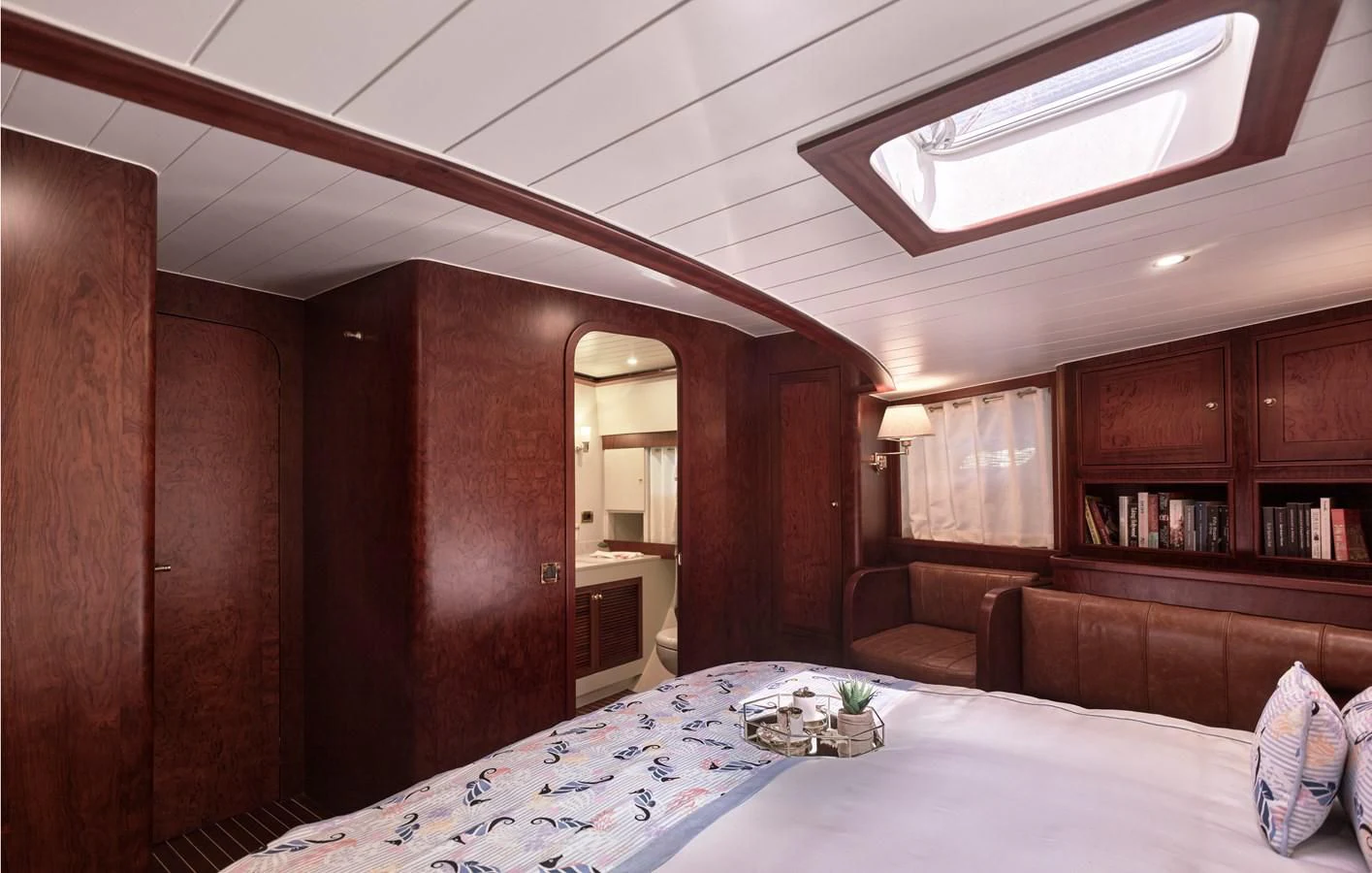 a room with a bed and a couch aboard KAFTAN Yacht for Sale
