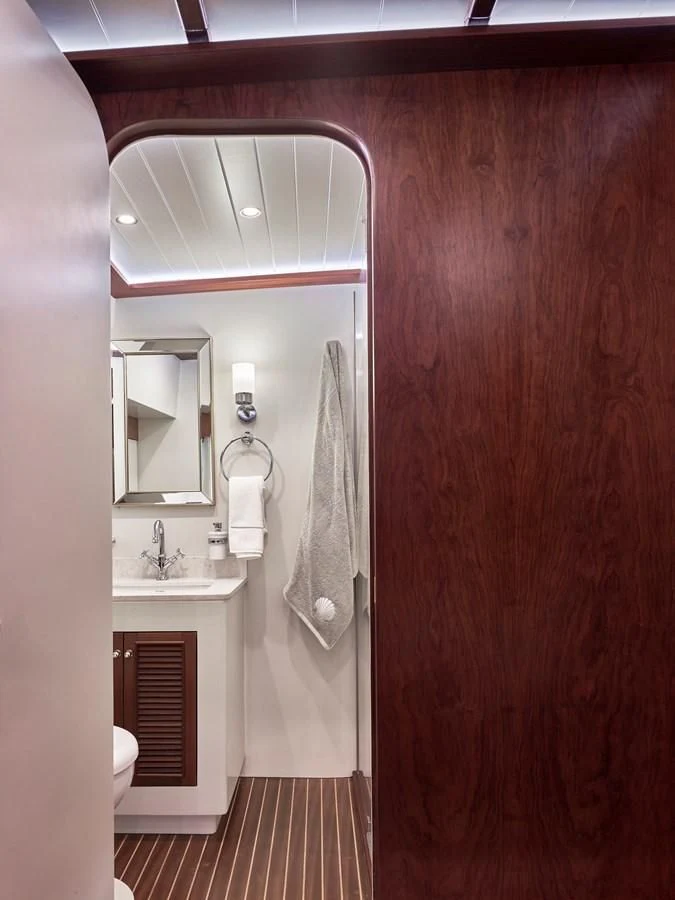 a bathroom with a sink and a mirror aboard KAFTAN Yacht for Sale