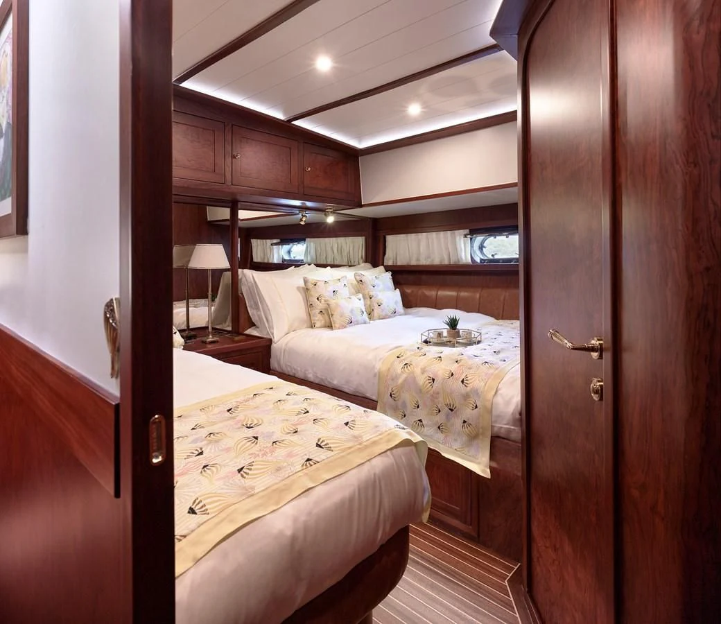 a room with two beds aboard KAFTAN Yacht for Sale