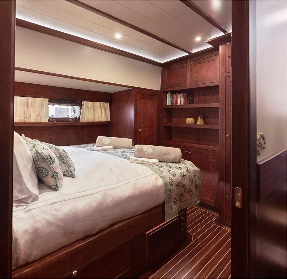 a bed in a room aboard KAFTAN Yacht for Sale