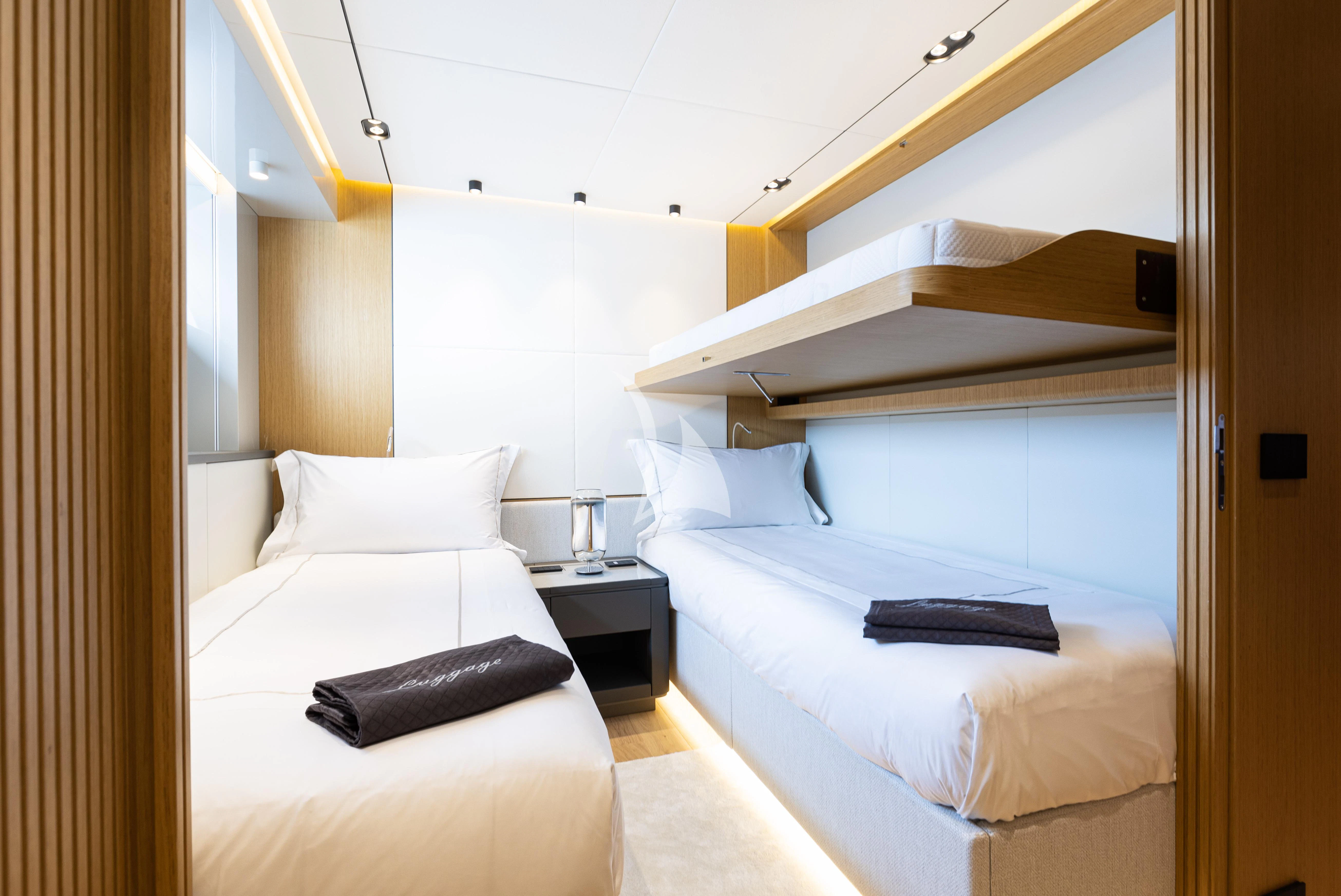 a room with two beds aboard IL SOGNO Yacht for Sale