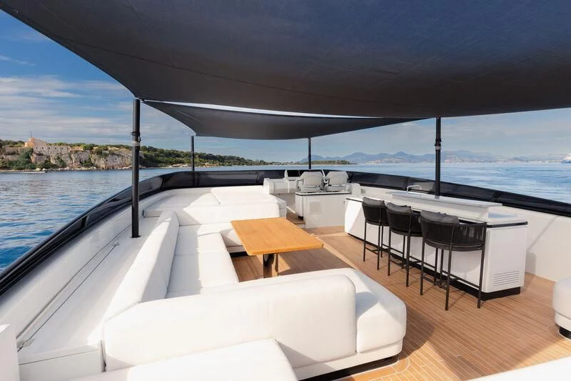 a deck with a table and chairs on it aboard IL SOGNO Yacht for Sale
