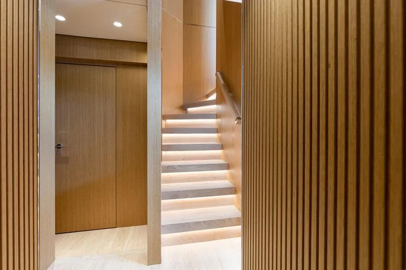 a hallway with a wood door aboard IL SOGNO Yacht for Sale