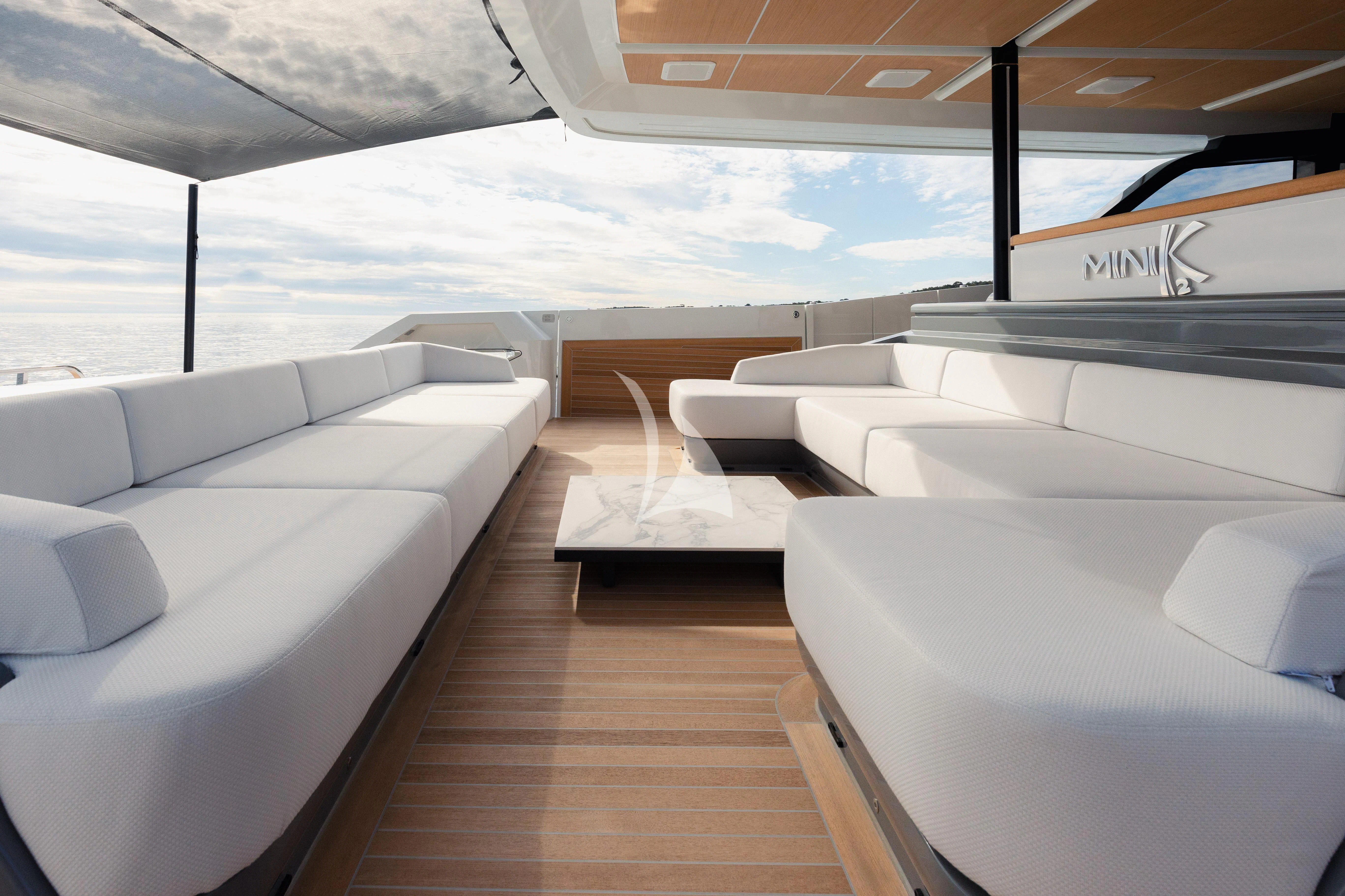 a room with white couches aboard IL SOGNO Yacht for Sale