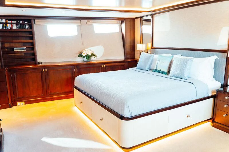 a bed in a room aboard ODYSSEY III Yacht for Sale