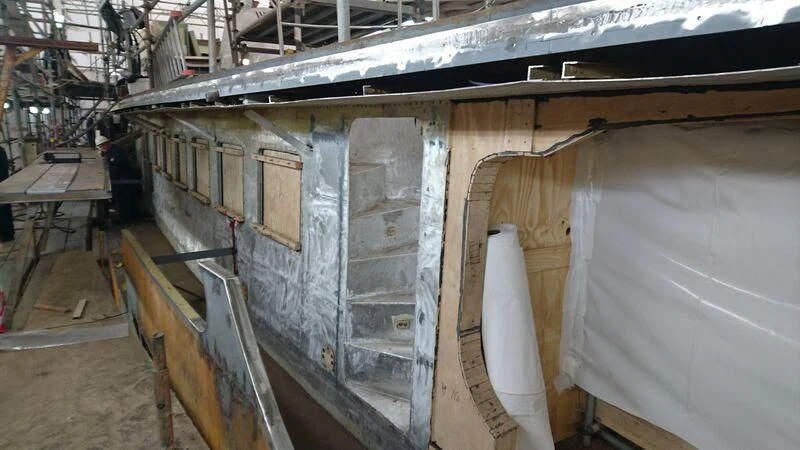a building with a lot of windows aboard ODYSSEY III Yacht for Sale