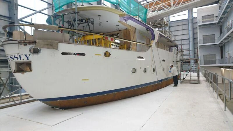 a large white ship in a building aboard ODYSSEY III Yacht for Sale