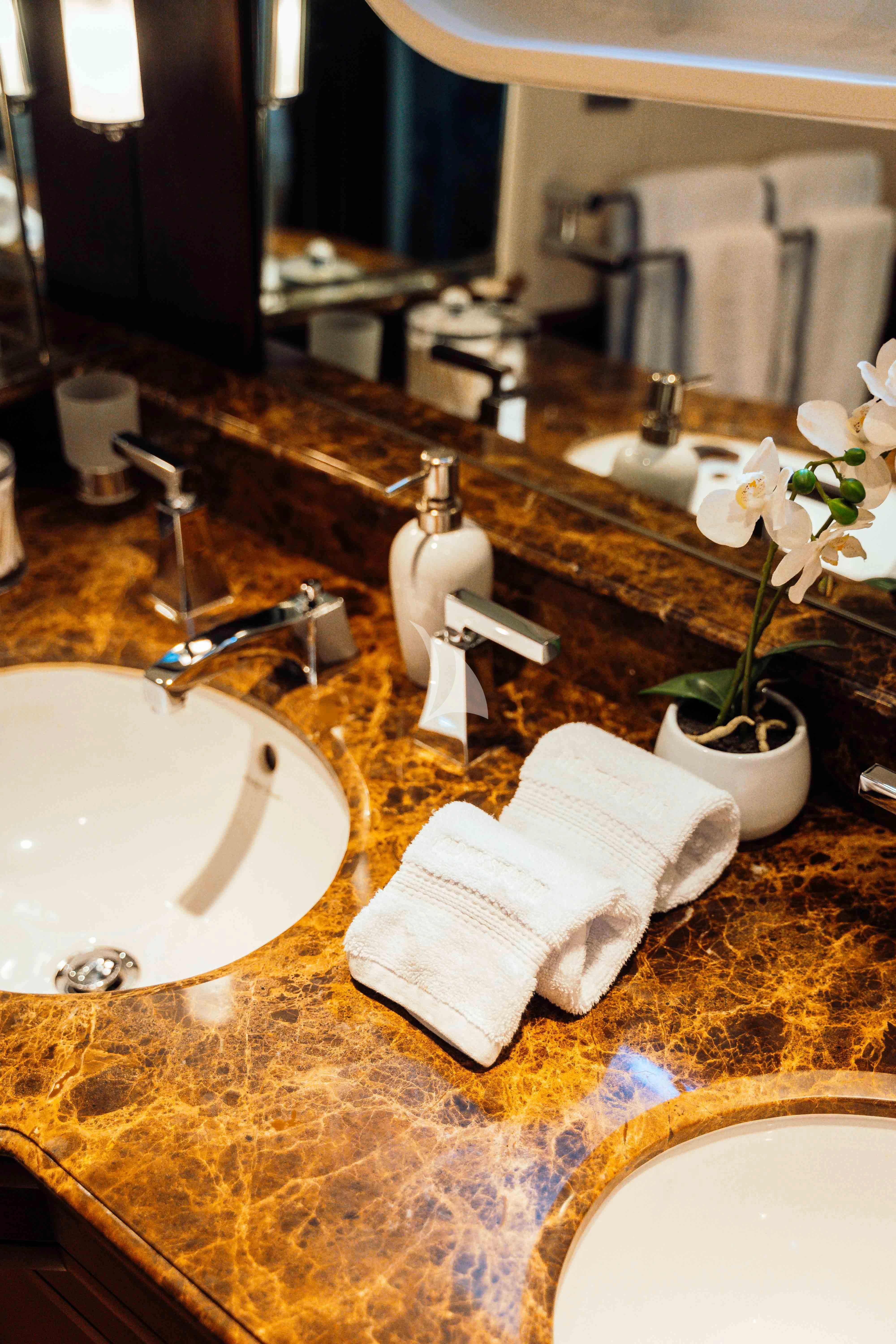 a bathroom with a sink and a mirror aboard ODYSSEY III Yacht for Sale