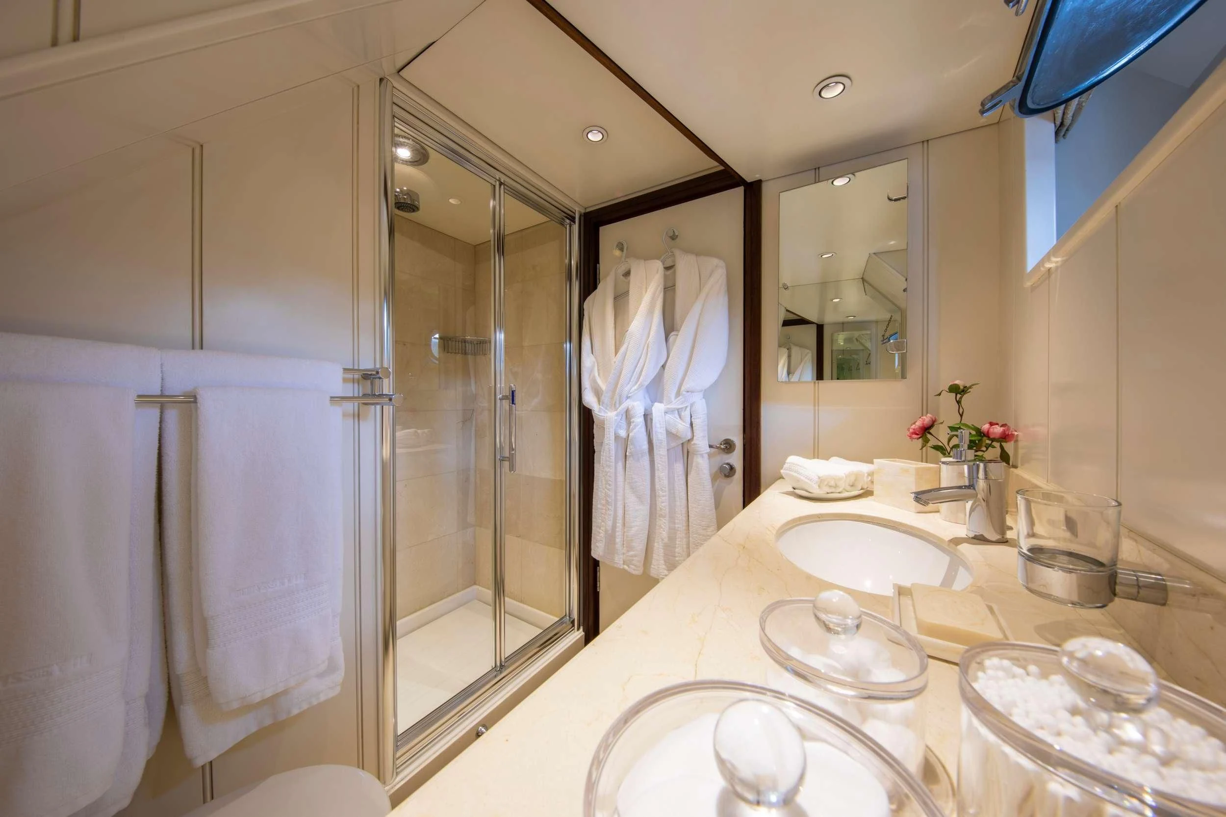a bathroom with a large mirror aboard ODYSSEY III Yacht for Sale