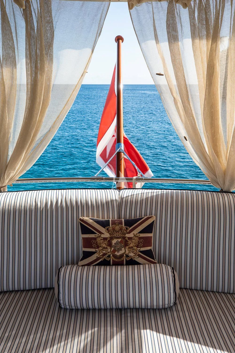 a boat with a flag on it aboard ODYSSEY III Yacht for Sale