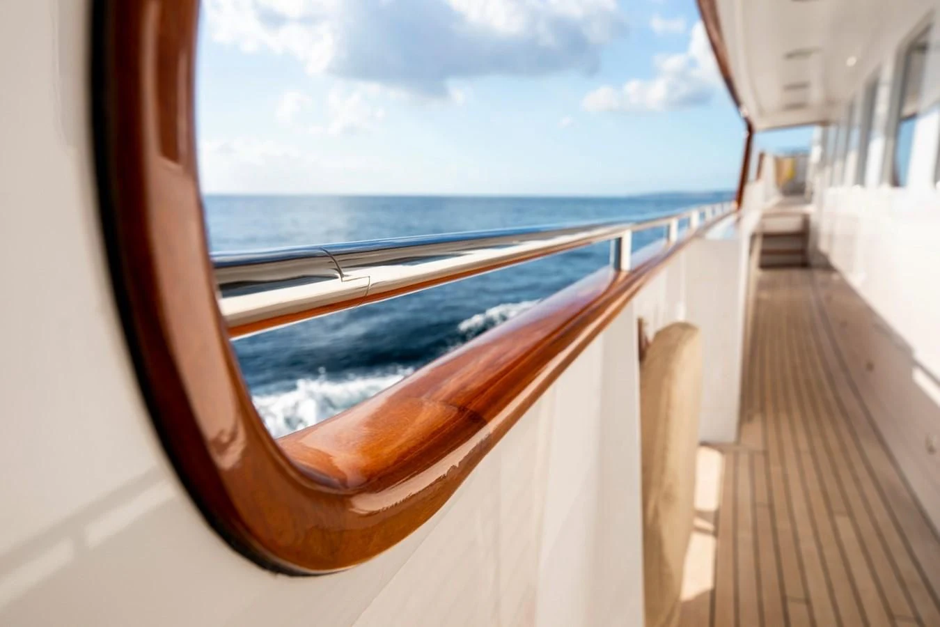 a wooden walkway on a boat aboard ODYSSEY III Yacht for Sale