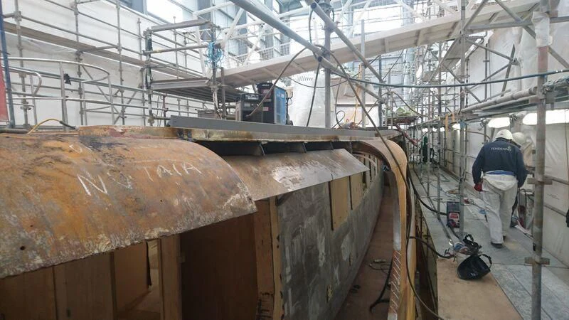 a person working in a factory aboard ODYSSEY III Yacht for Sale