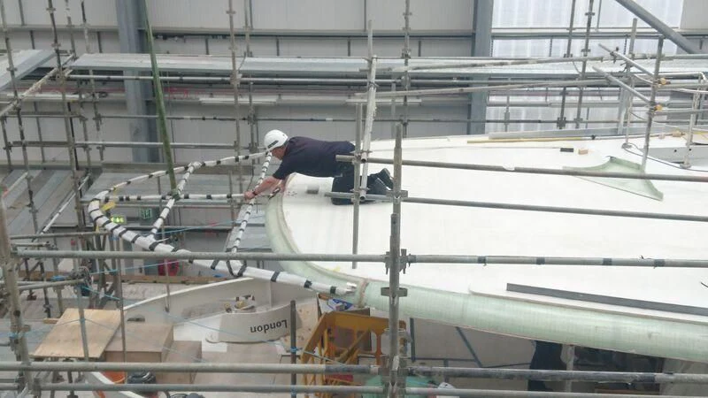 a person working on a white boat aboard ODYSSEY III Yacht for Sale