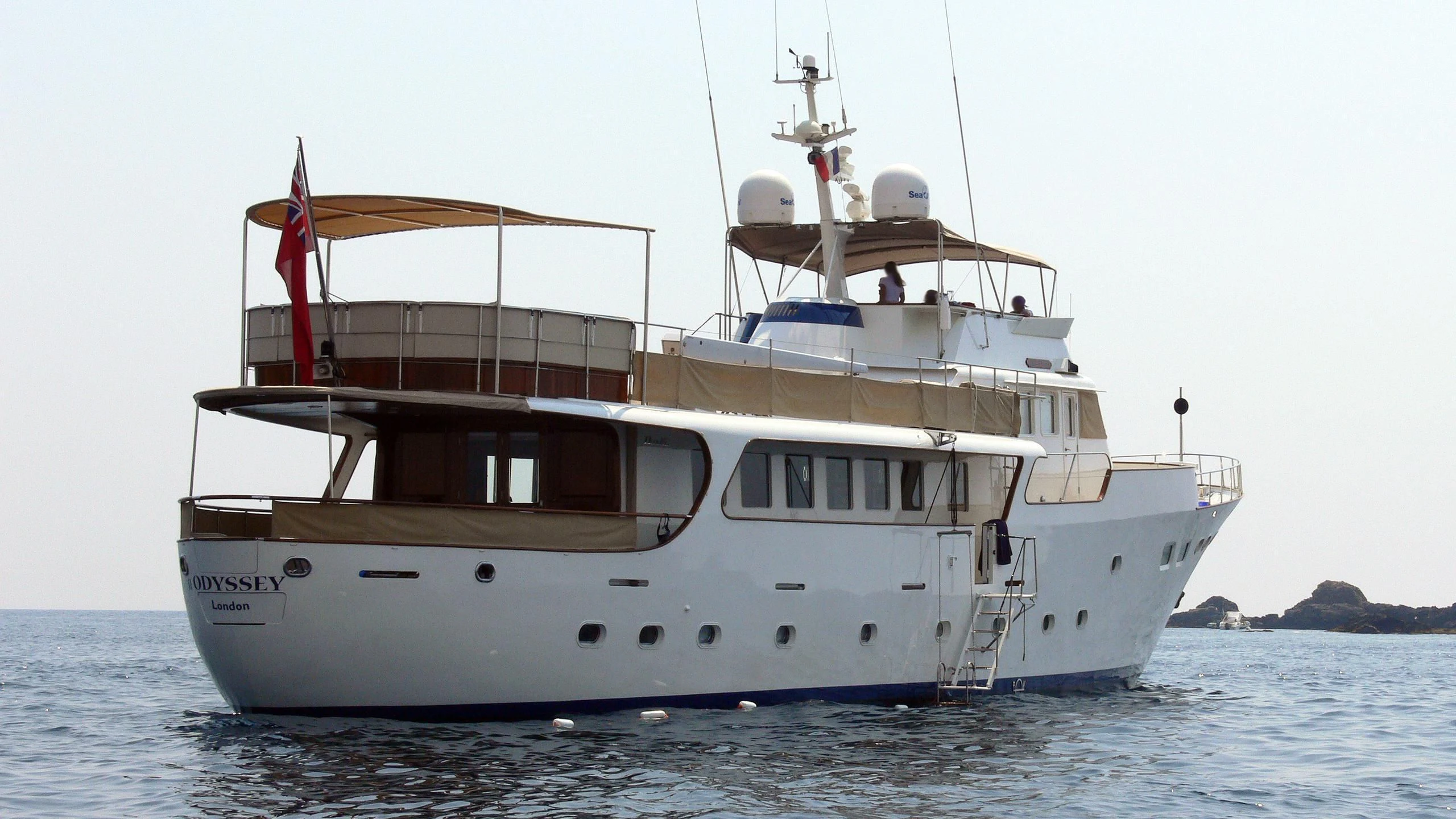 a large white boat in the water aboard ODYSSEY III Yacht for Sale