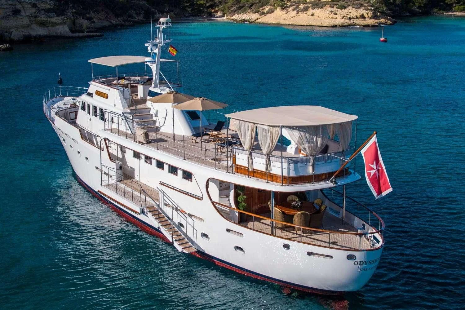 a large white boat in the water aboard ODYSSEY III Yacht for Sale