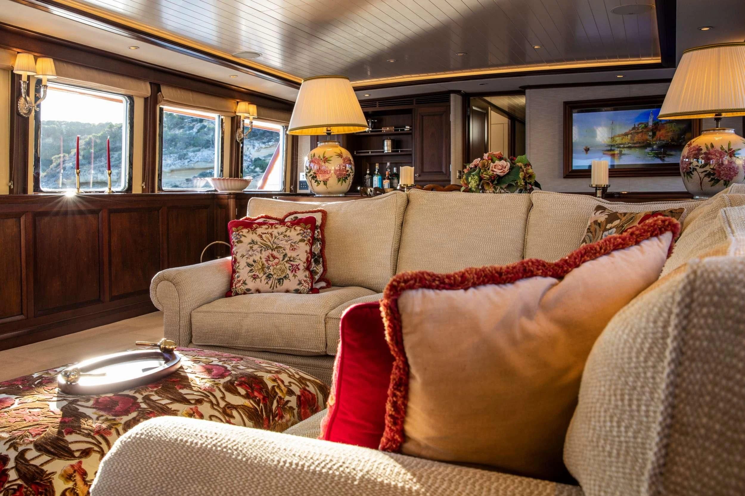 a living room with a couch and a lamp aboard ODYSSEY III Yacht for Sale