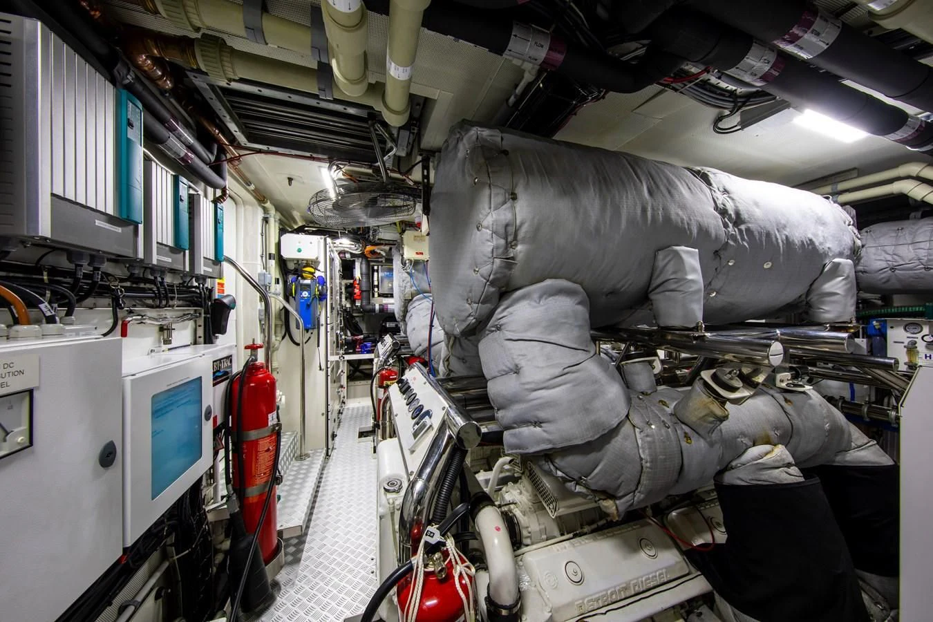 a large vehicle in a room aboard ODYSSEY III Yacht for Sale
