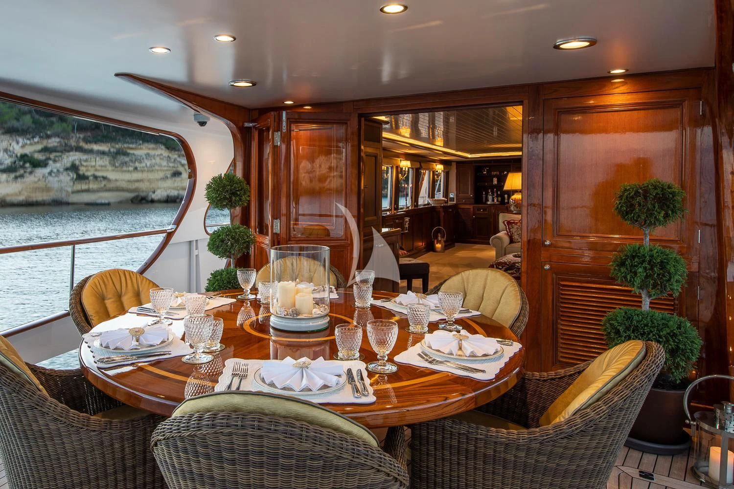 a dining room with a table set aboard ODYSSEY III Yacht for Sale