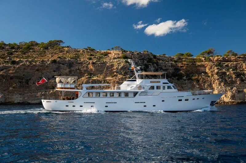 a boat on the water aboard ODYSSEY III Yacht for Sale
