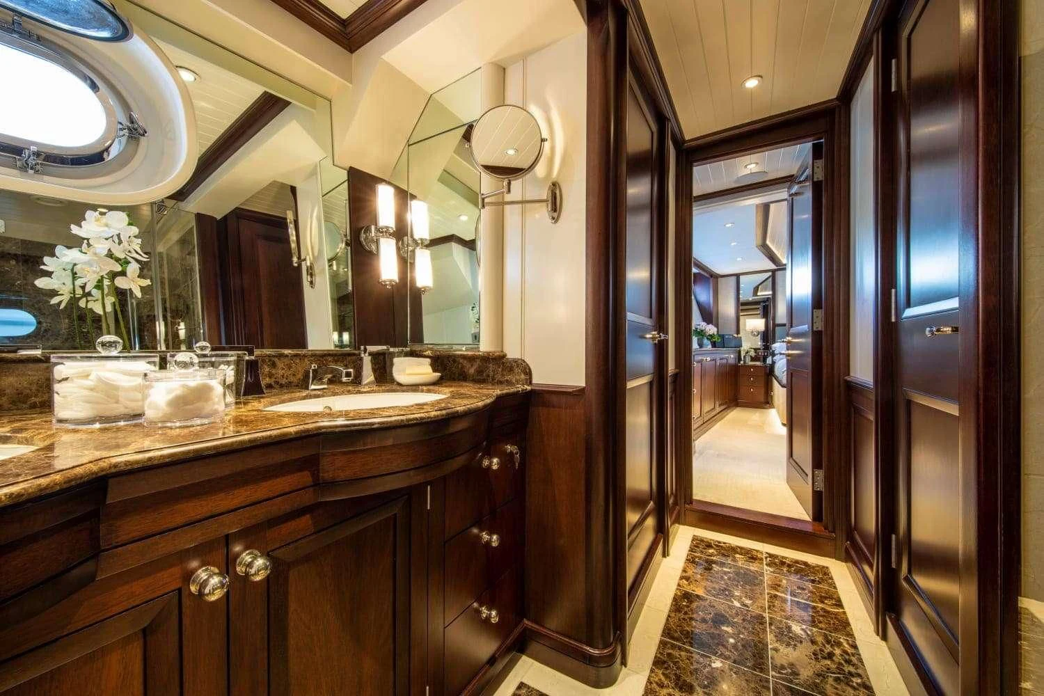 a bathroom with marble counters aboard ODYSSEY III Yacht for Sale