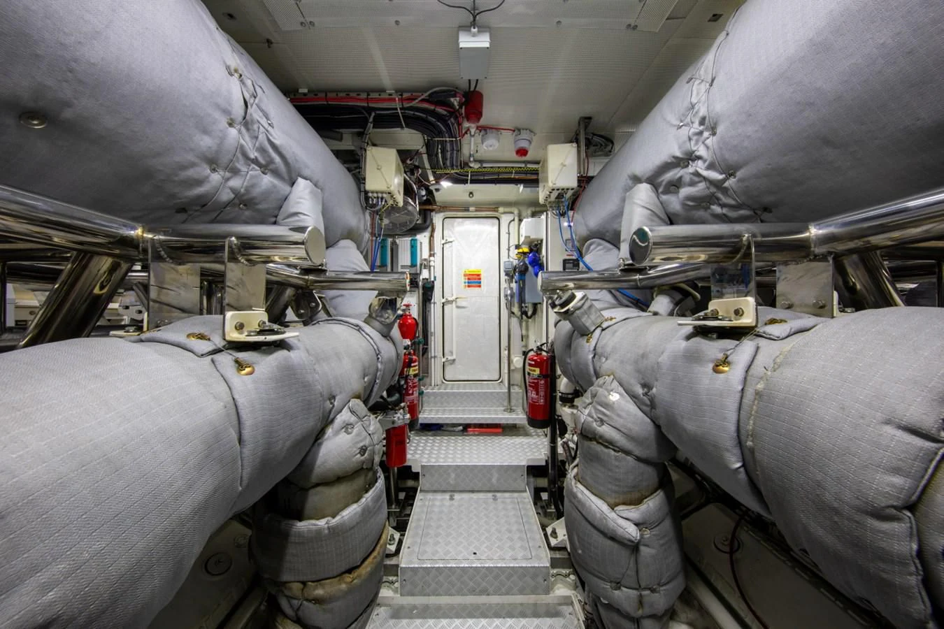 a large machine in a room aboard ODYSSEY III Yacht for Sale