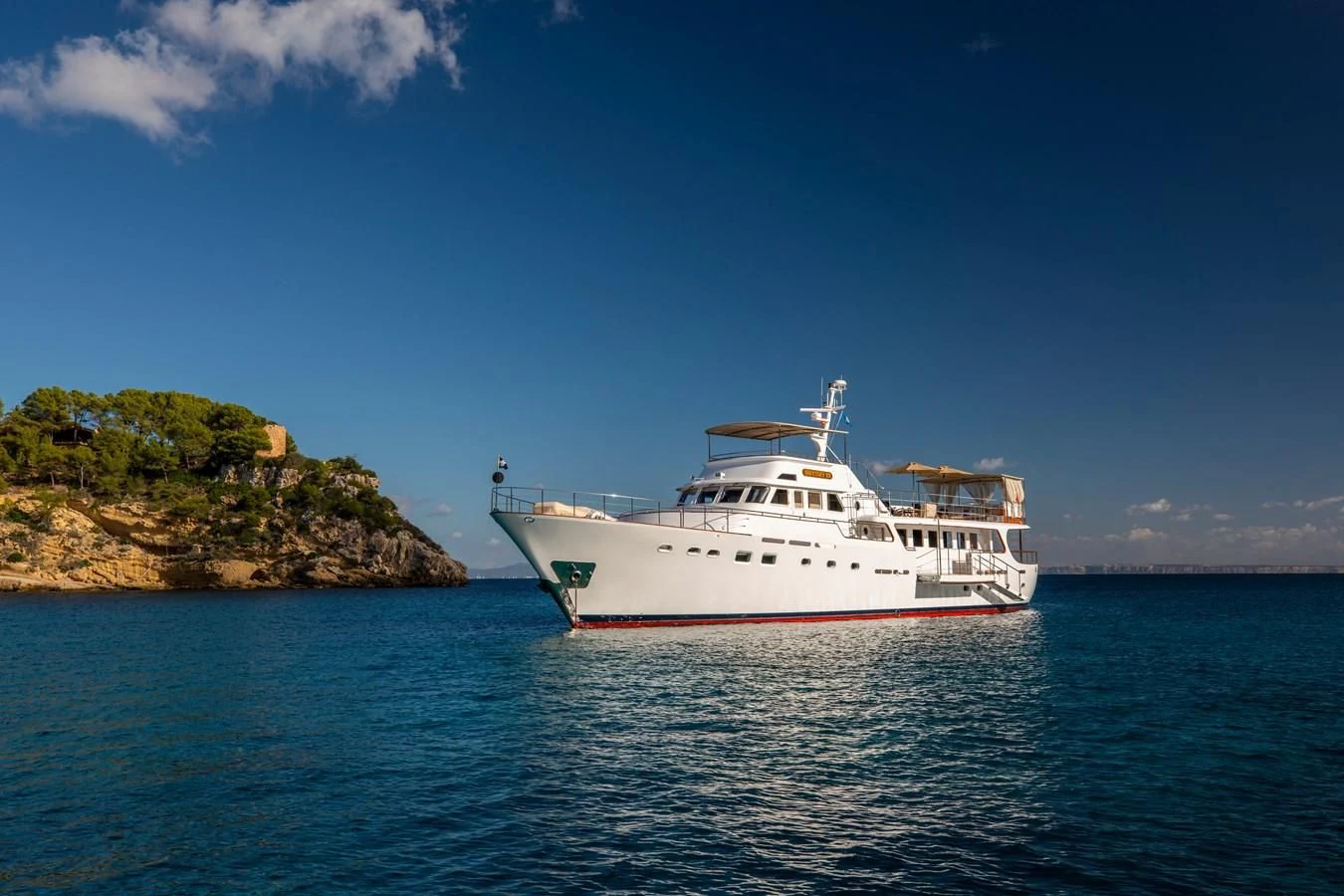 a white boat in the water aboard ODYSSEY III Yacht for Sale